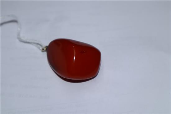A yellow metal mounted natural amber pebble pendant, with GCS certificate dated 8/5/19.